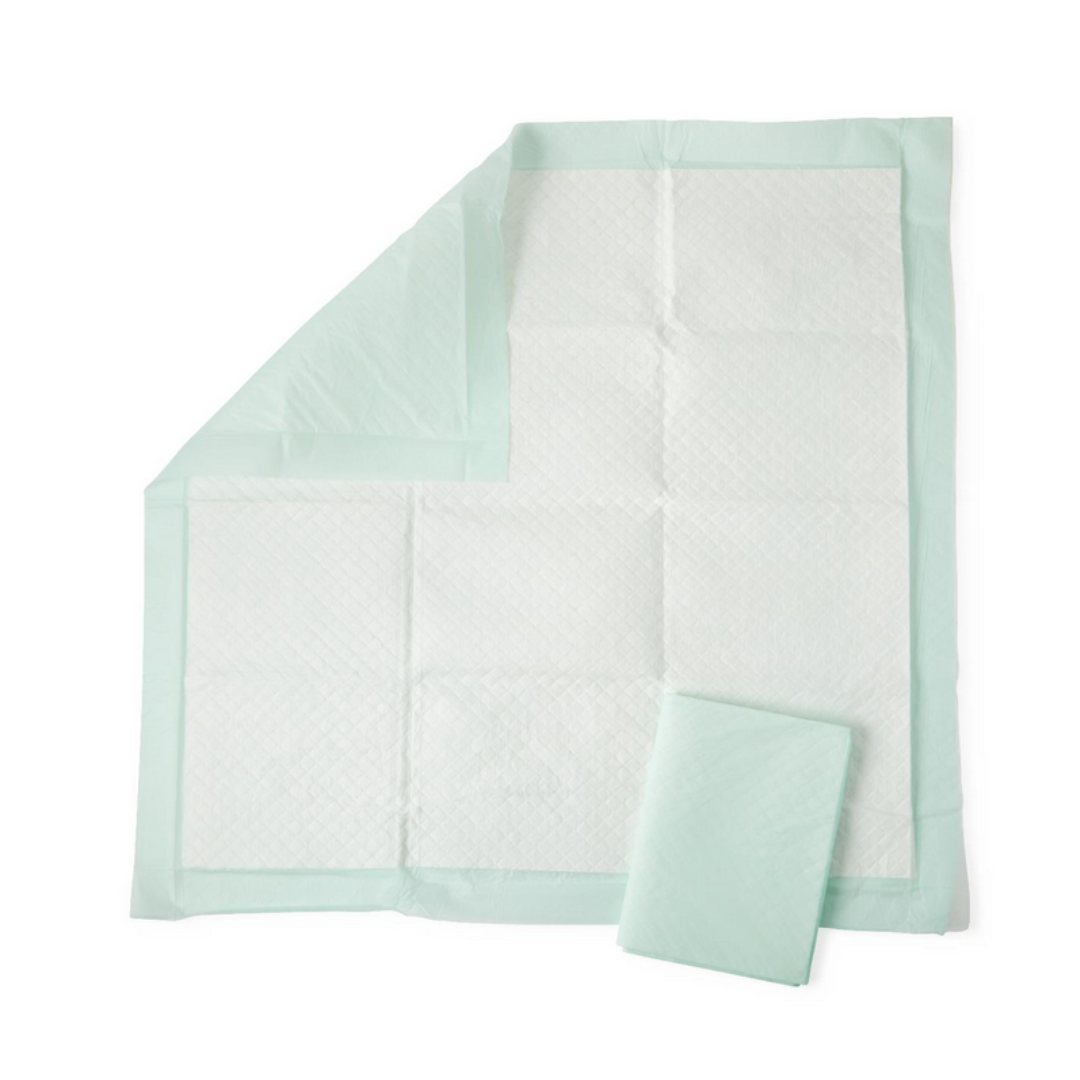 The Medline Disposable Fluff and Polymer Underpads - Heavy Absorbency are highlighted, with a light green plastic border and layers partially revealed. A folded pad on top ensures surfaces remain moisture-free.